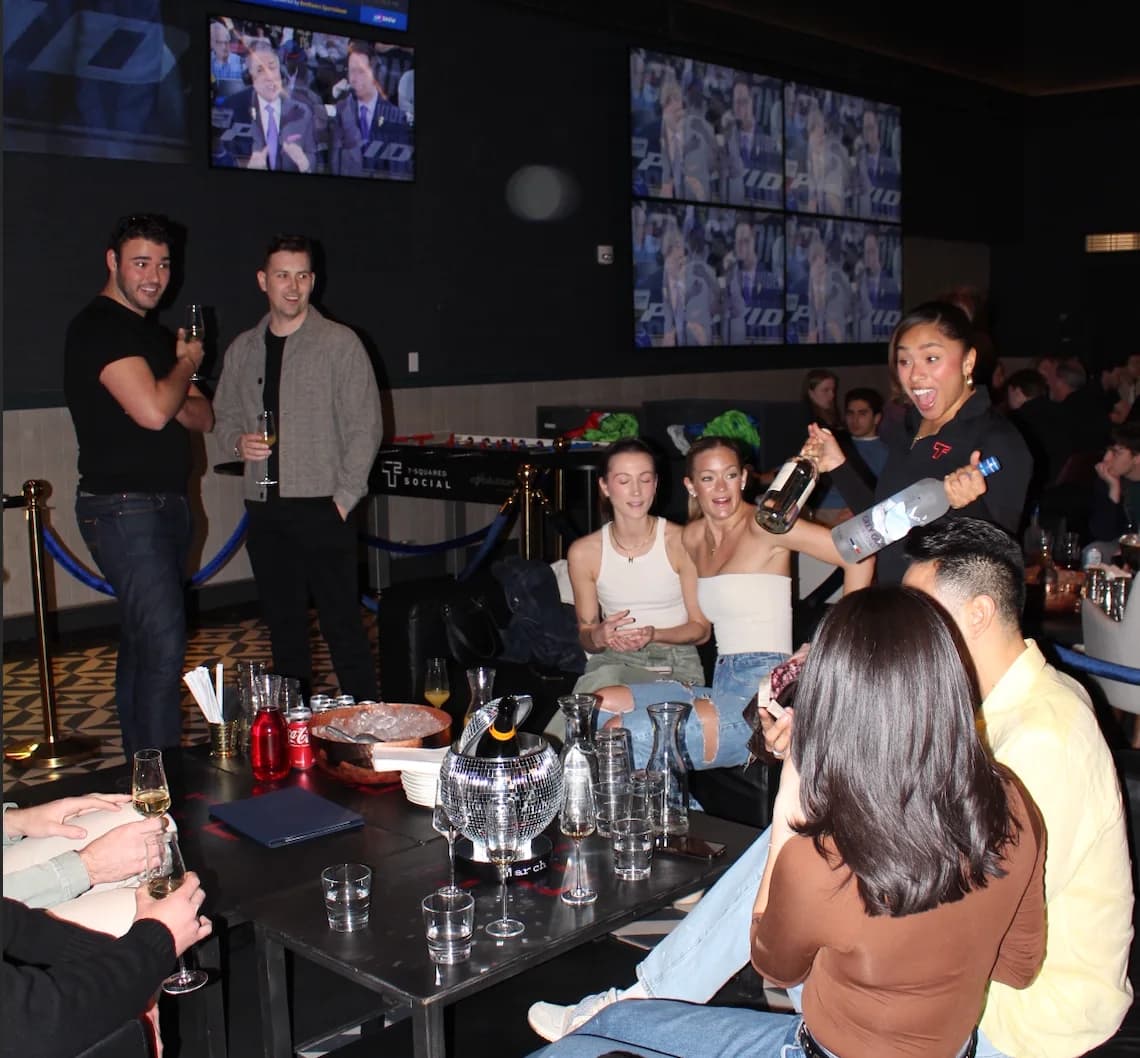 Interior of T-Squared Social in Midtown Manhattan with games and large screens