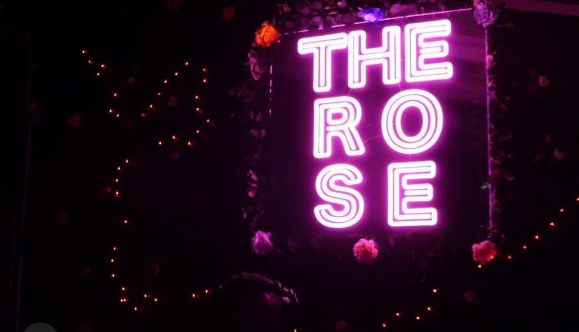 The Rose Chelsea neon pink bar interior with immersive lighting