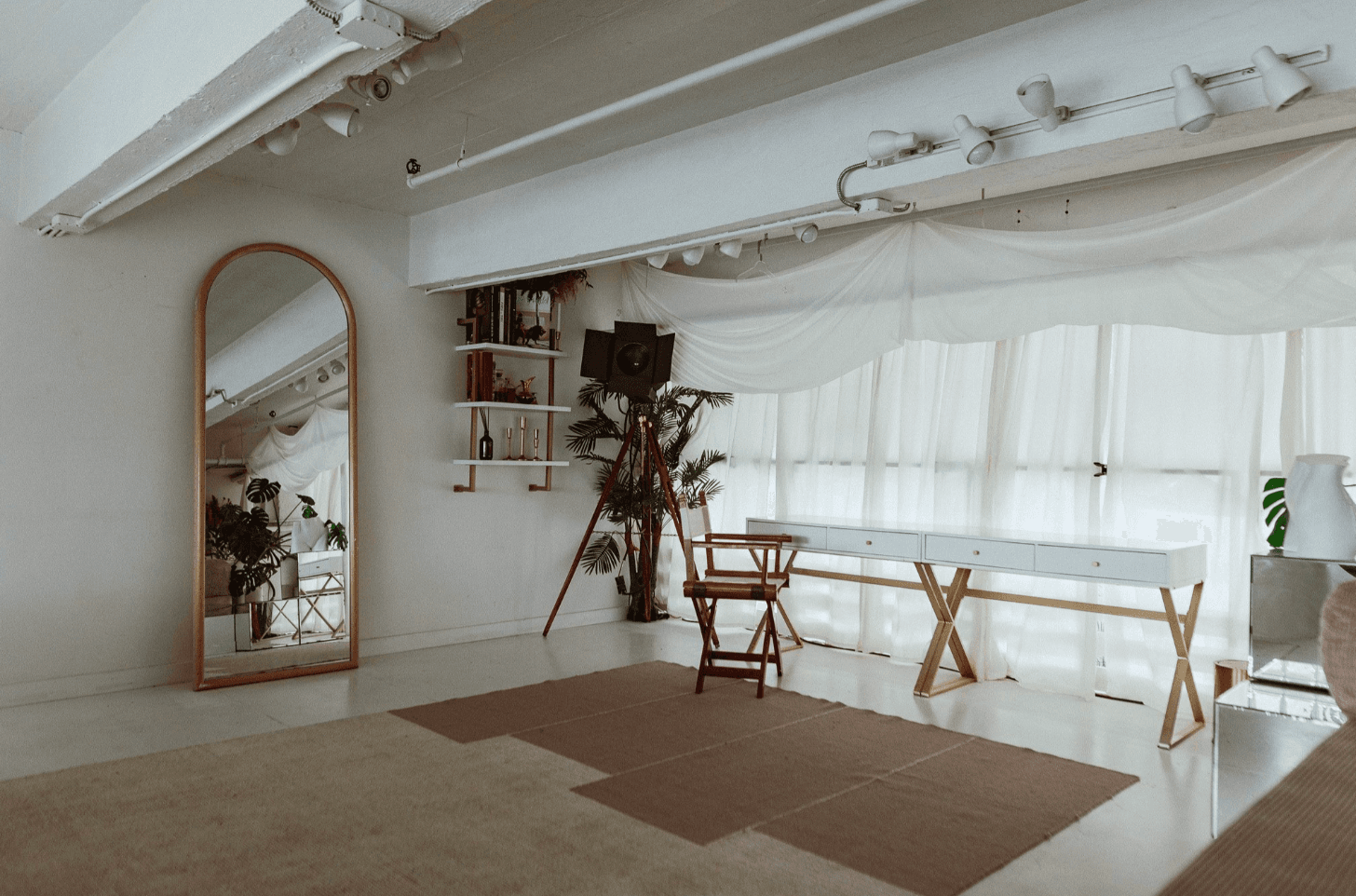 Bright white minimalist event space with high ceilings at Atmosfera in Astoria, Queens