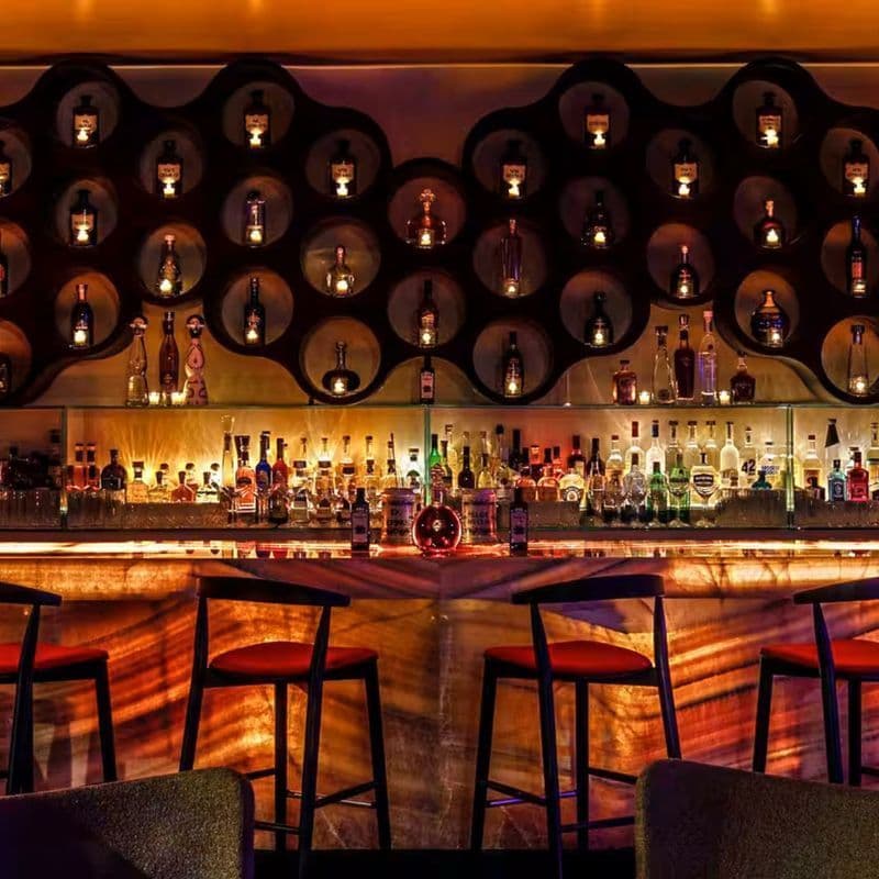 Mood-lit lounge interior with art installations at DOM in Gramercy