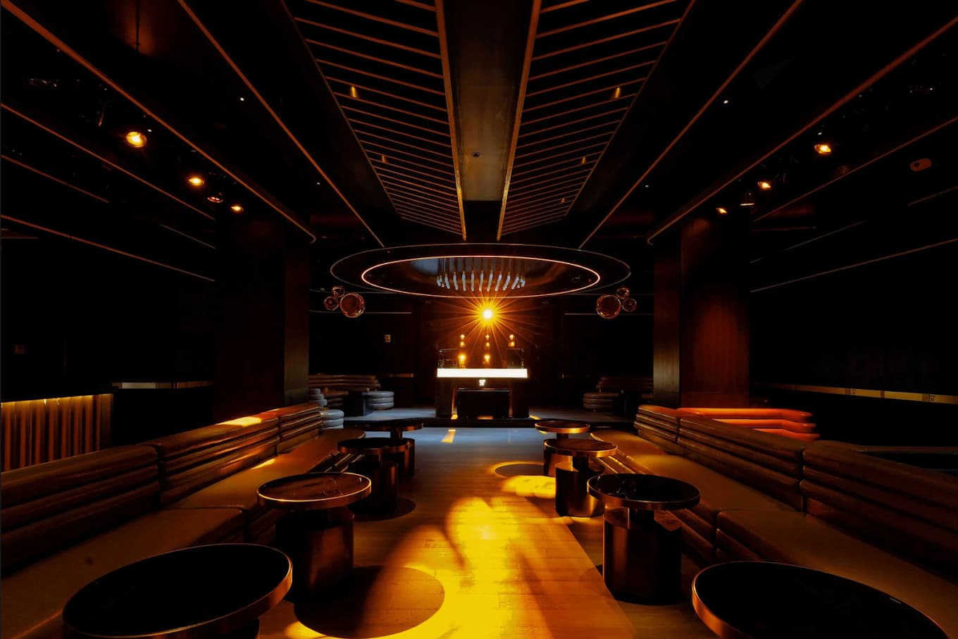 Aura 57 NYC upscale lounge interior with plush seating and ambient lighting