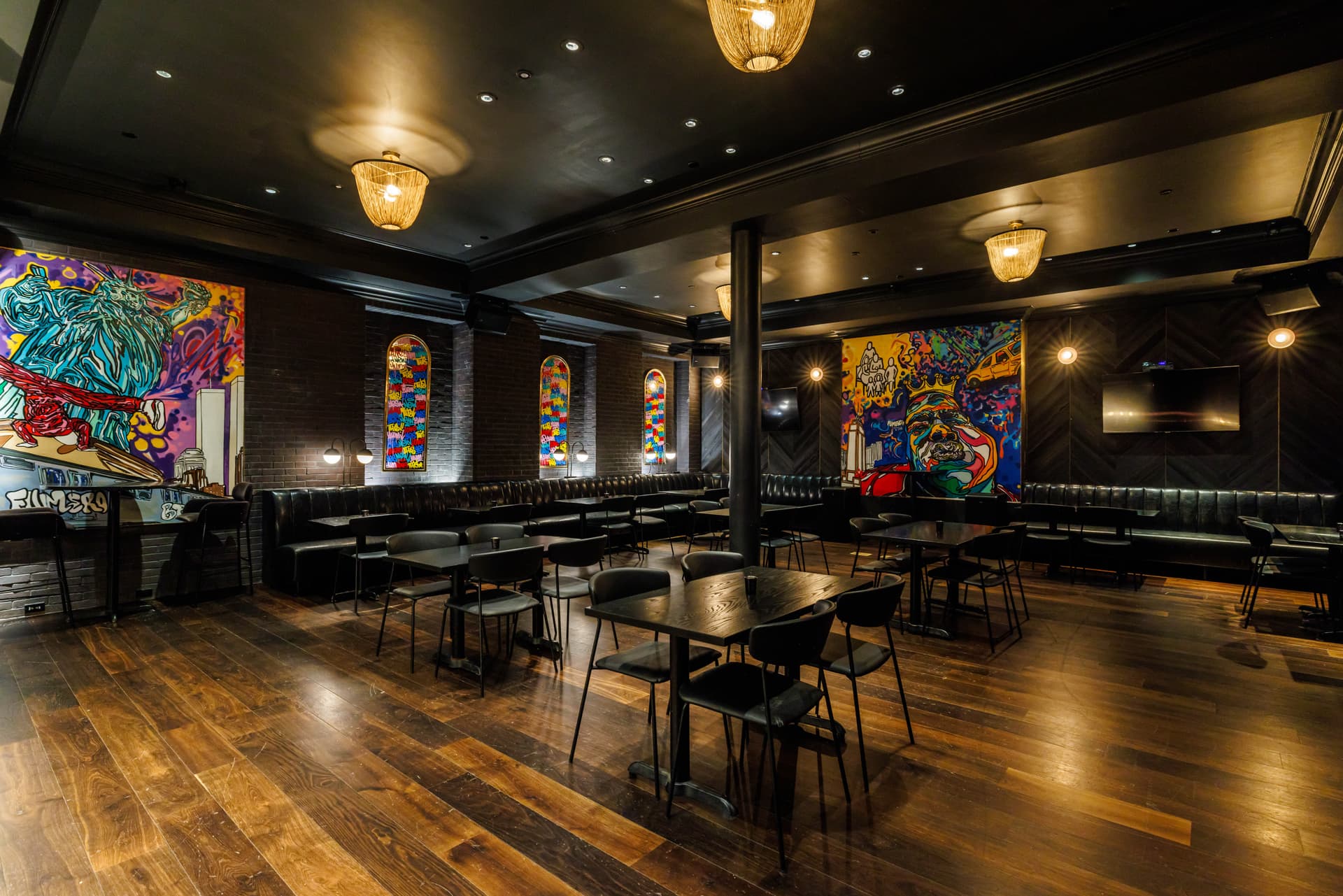 Dim, art-accented lounge interior at Lot 15 in the Kixby Hotel in midtown