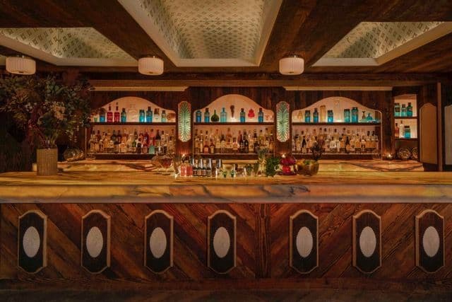 The Speakeasy room at Apotheke NoMad with plush lounge seating and moody lighting