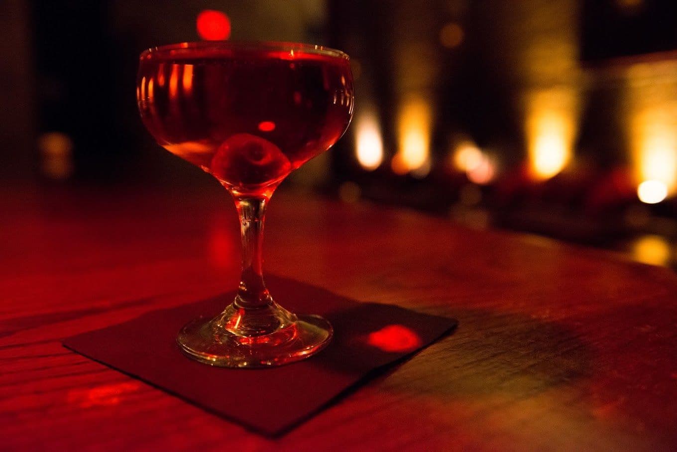 Exposed brick bar interior with warm lighting at Velvet Brooklyn in Williamsburg
