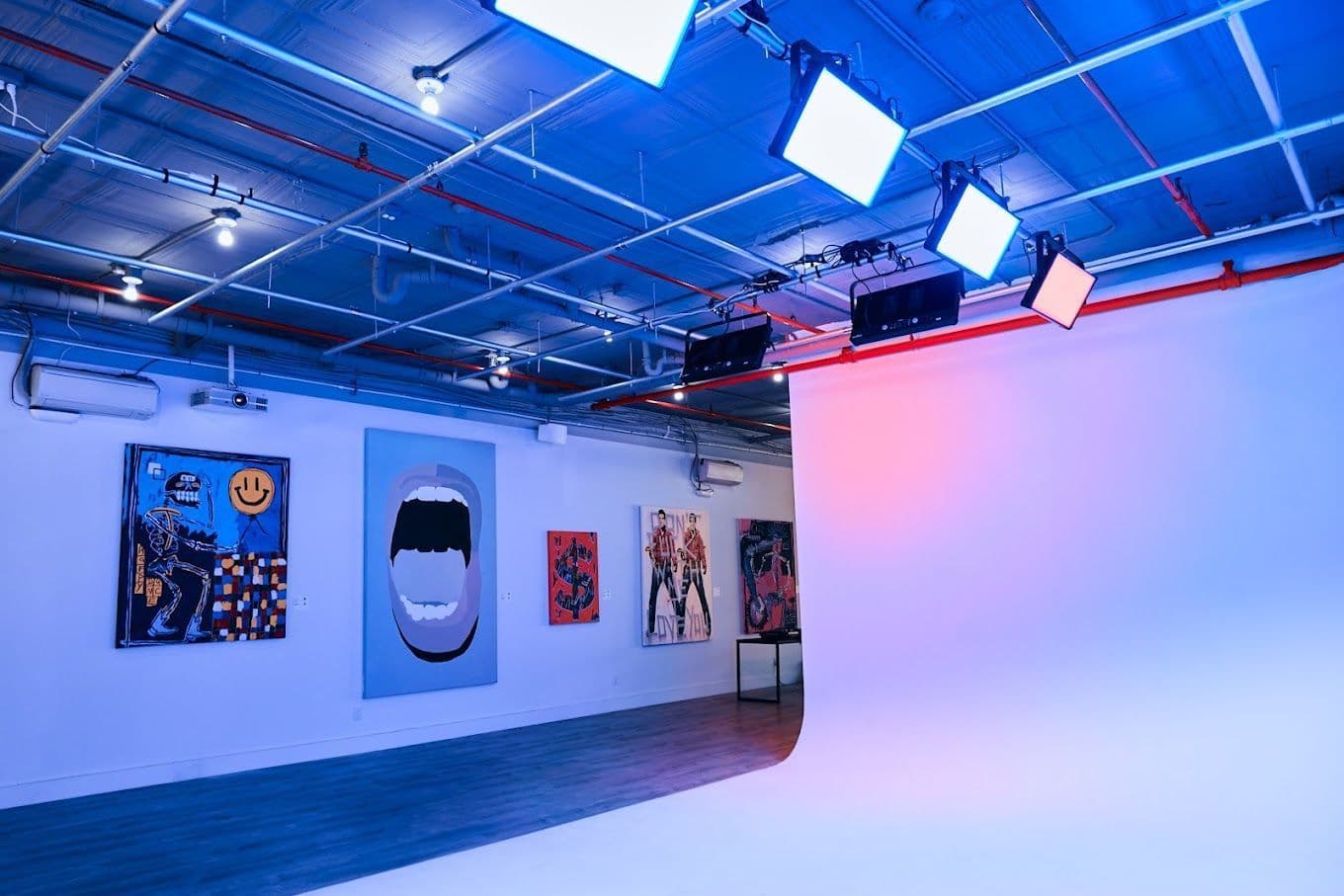 Open loft gallery space with brick walls and large windows at G-Gallery in SoHo