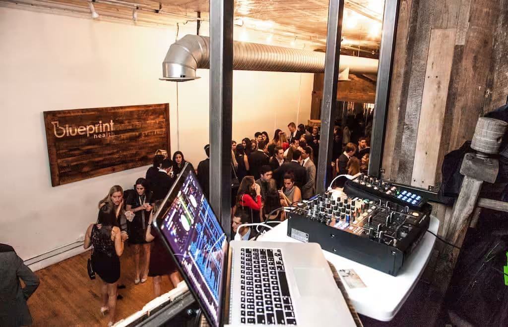 Rustic loft event space at The Farm Soho with high ceilings and large windows