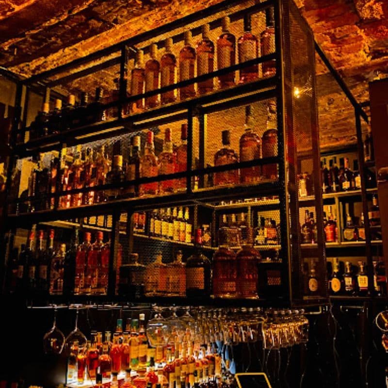 Intimate lounge seating and bar area at Whiskey Cellar in the East Village