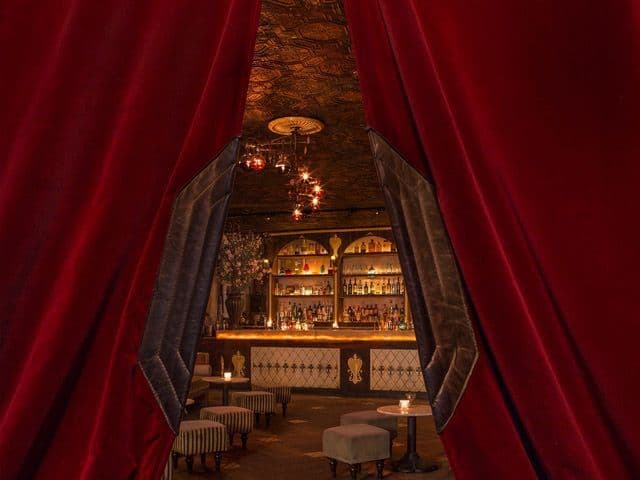 Dim, atmospheric cocktail bar interior at Apotheke on Doyers Street in Chinatown