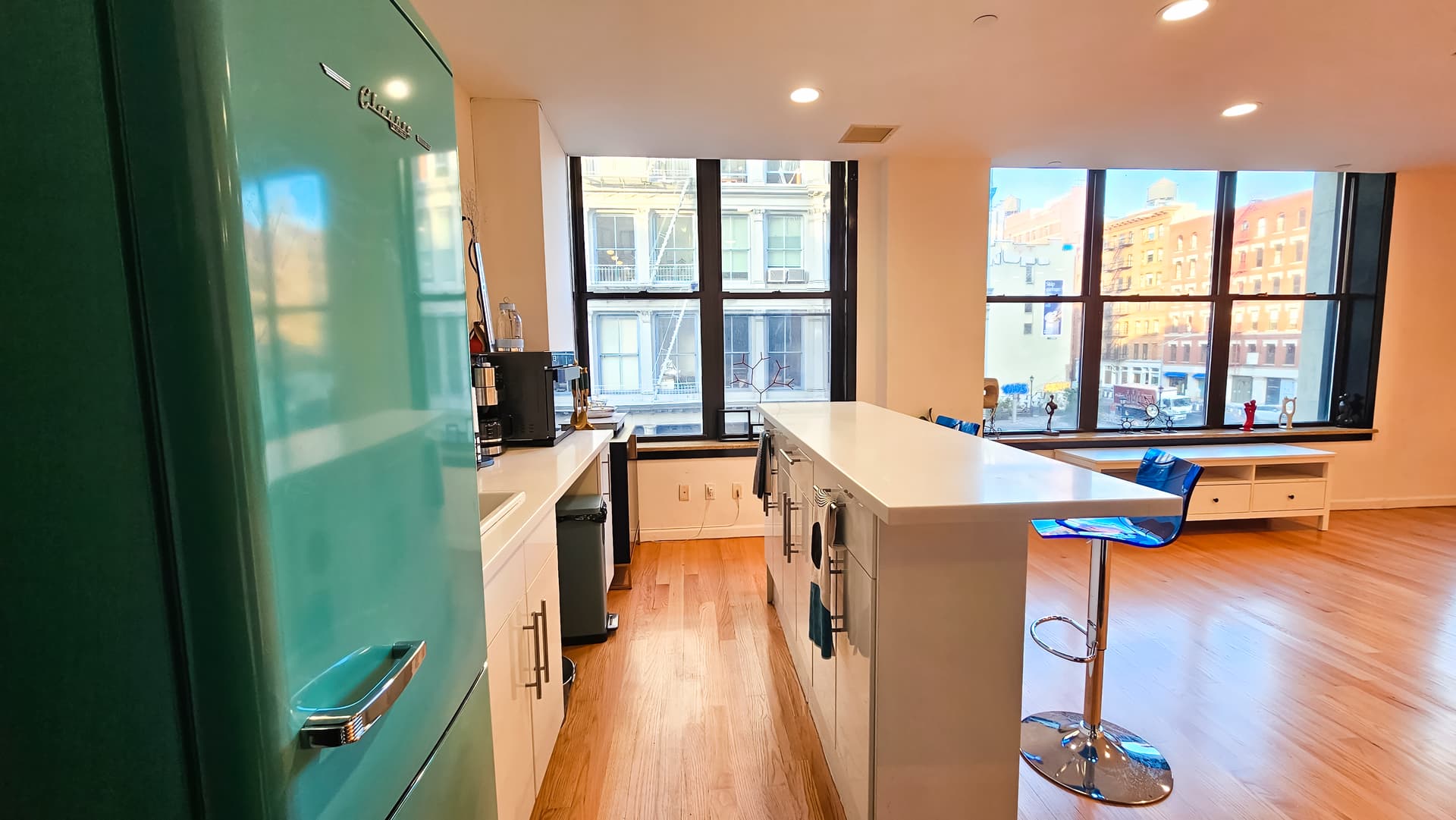 Open full-floor gallery loft with large windows at Moonzescope in SoHo