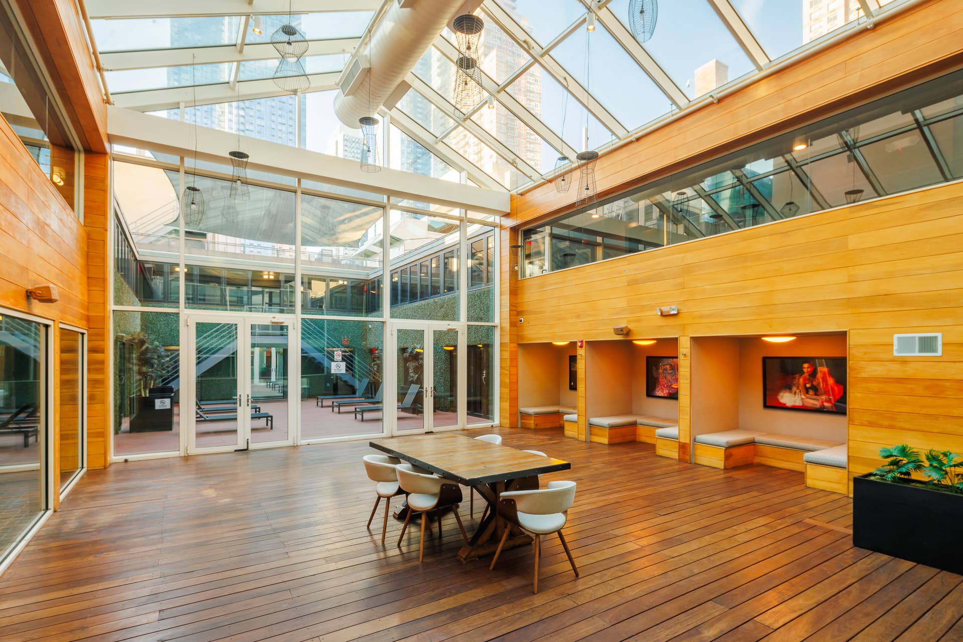 Sunlit glass-ceiling atrium event space at Hudson Yards Hotel