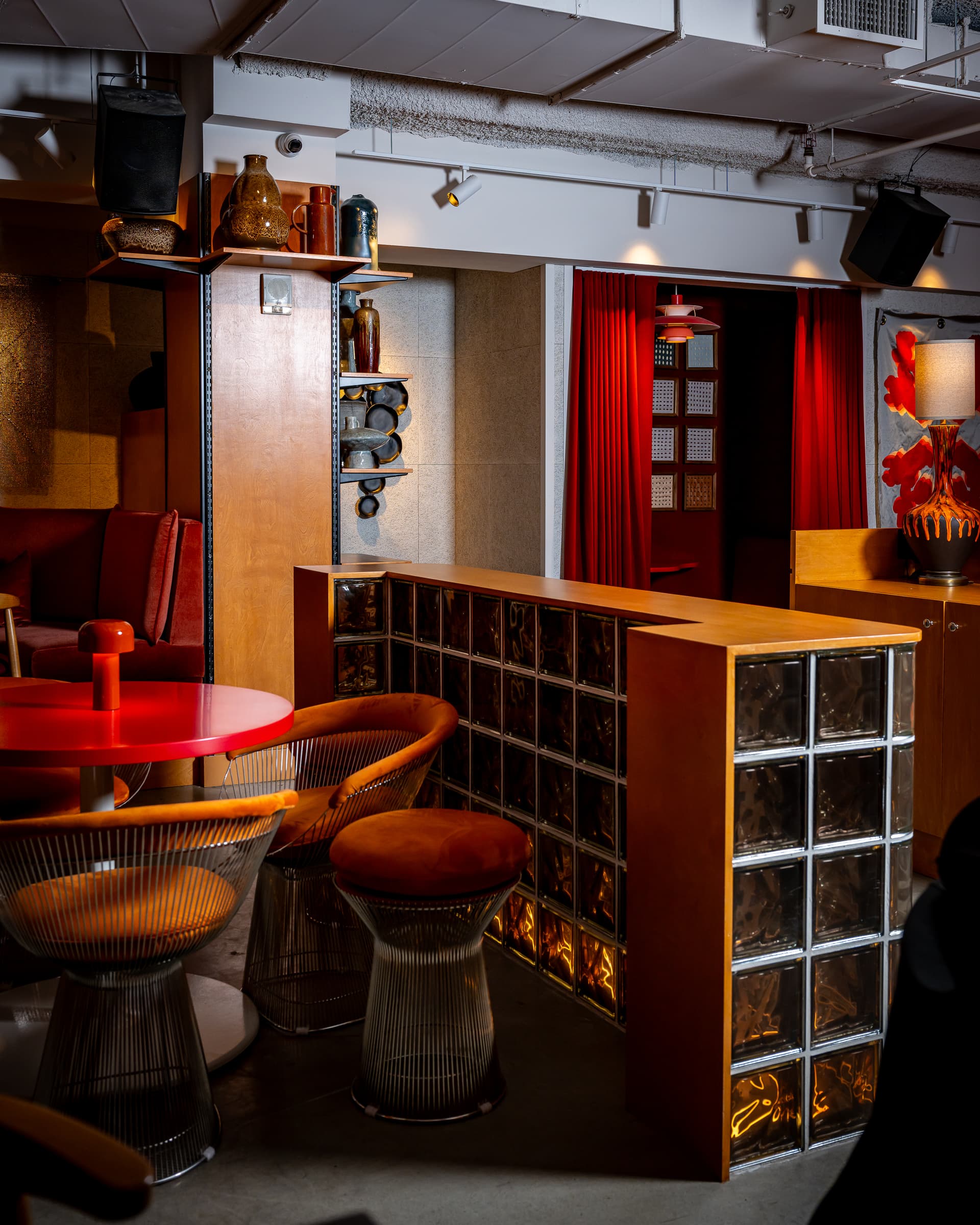 Retro-styled lounge seating and bar at Seed Library NYC