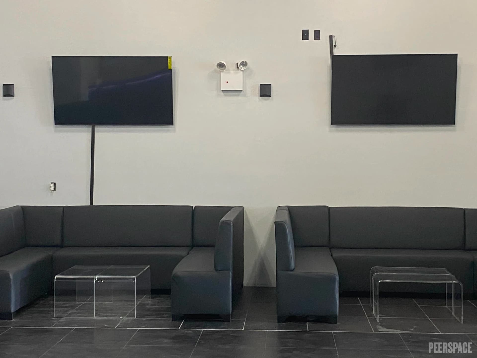 Open warehouse interior at Orion's LLC in the Bronx with high ceilings and lounge furniture
