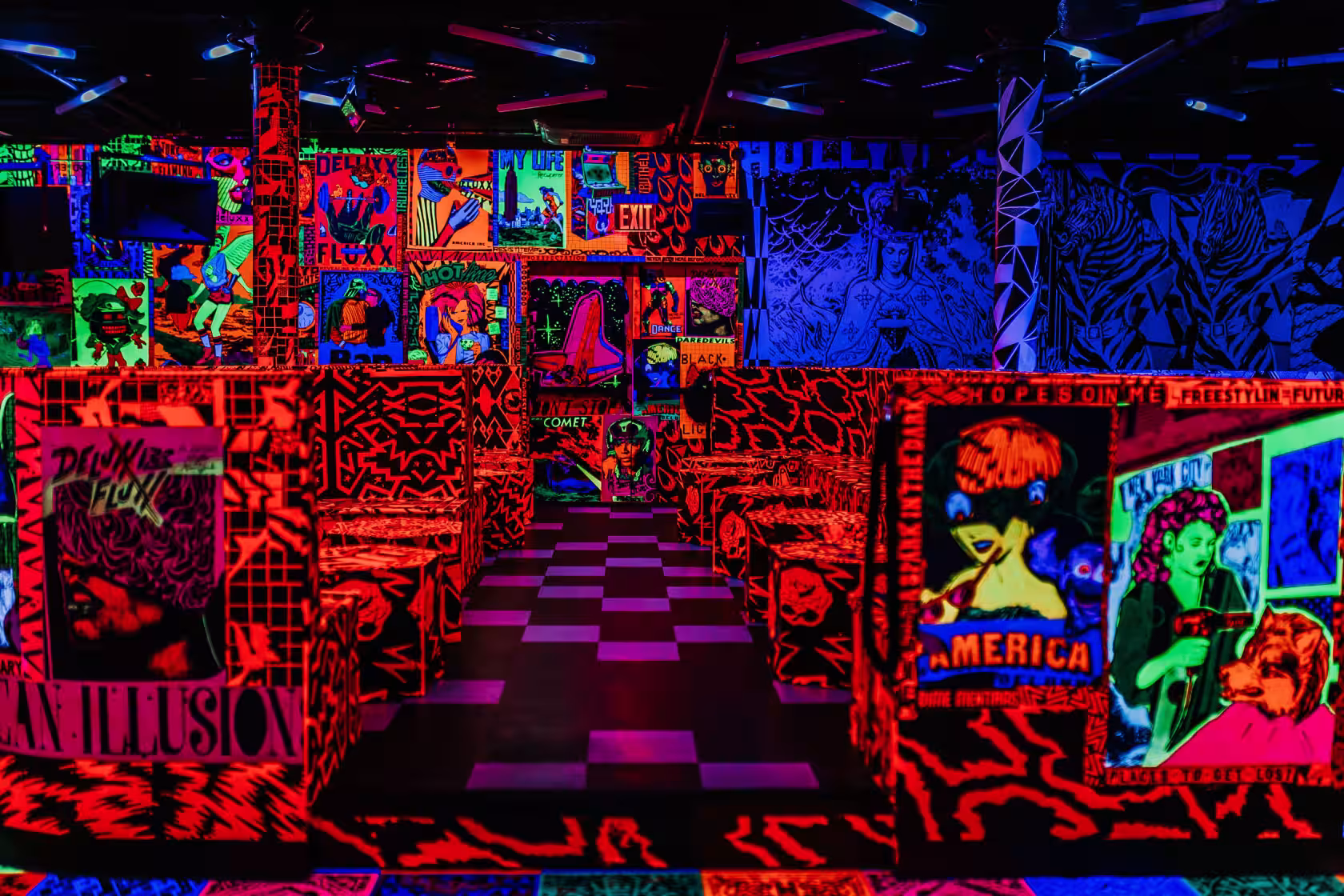 Neon-lit interior with custom arcade cabinets at Deluxx Fluxx near Union Square