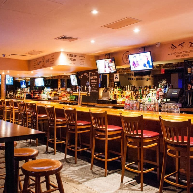 Interior bar and seating area at Josie Woods Pub in Greenwich Village